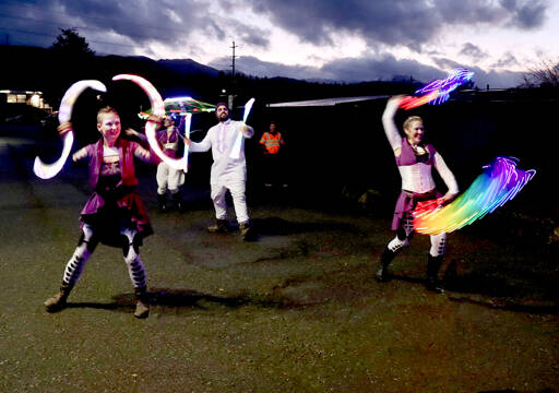 “Fractal Phase,” dancing with various lights, highlighted the Wintertide Festival of Lights on Saturday at the Port Angeles Fine Arts Center. A large gathering of people cool temperatures to see lights, entertainment, consume food and get a chance to buy Christmas gifts. (Dave Logan/for Peninsula Daily News)