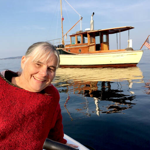 Betsy Davis, the executive director of the Northwest School of Wooden Boatbuilding, with her 1914 wooden boat “Glory Be.” (Northwest School of Wooden Boatbuilding)