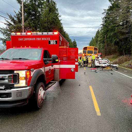 A 40-year-old Quilcene man died and a 7-year-old boy was airlifted to a Seattle hospital after the car in which they were riding collided with the back of a school bus on Center Road on Friday morning. (East Jefferson Fire Rescue)