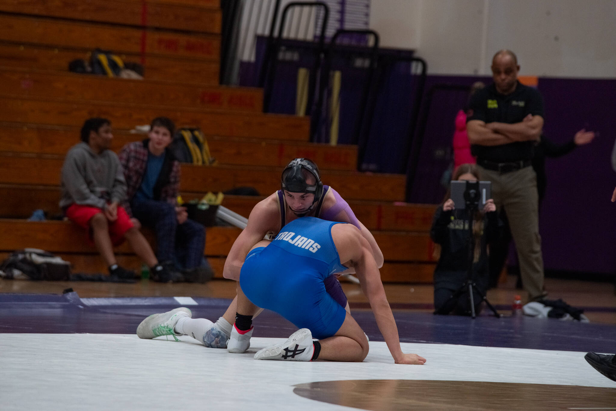 Emily Matthiessen/Olympic Peninsula News Group
Sequim's Jayms Vilona controls his Olympic opponent on the way to a 19-3 technical fall victory in the Wolves' dual-meet victory over the Trojans.