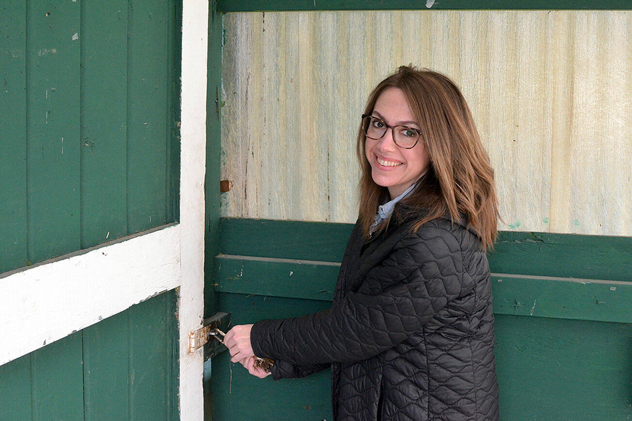 Executive Director Karly Mishko opens the Horticulture Building at Jefferson County Fairgrounds on Thursday. (Elijah Sussman/Peninsula Daily News)