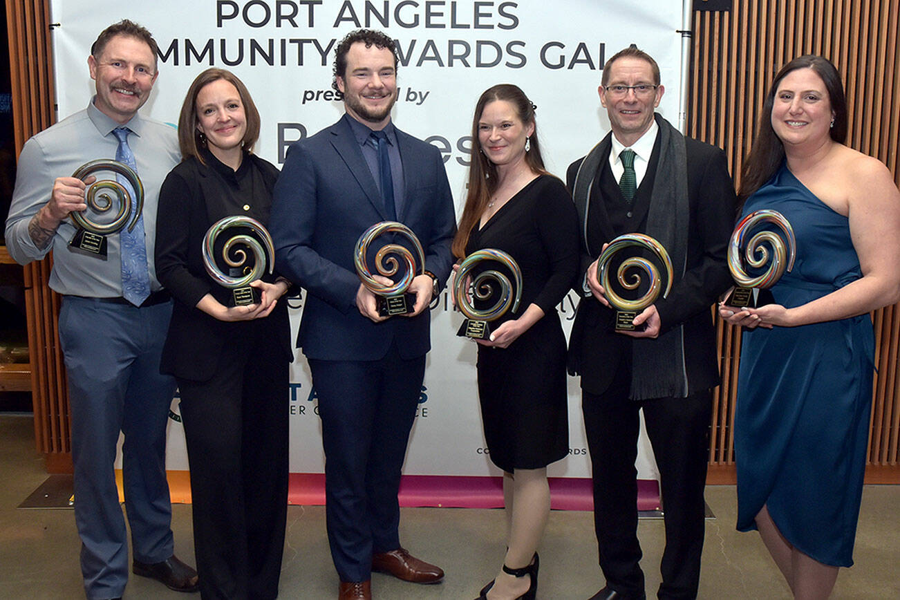 Recipients of Port Angeles Community Awards gather after Saturday night’s awards gala at Field Arts & Events Hall in Port Angeles. Winners were, from left, counselor Jason Gooding of the Port Angeles School District, educator of the year; Rose Thompson, executive director of the Dungeness Crab Festival and owner of Fogtown Coffee Bar, young leader of the year; Danny Steiger, CEO of Lumber Traders Inc., citizen of the year; Alicia Campion, administrator of Ridgeline Homecare Cooperative, emerging business of the year; Don Droz, general manager of Swain’s General Store, business of the year; and Elisia Anderson, executive director of First Step Family Support Center, organization of the year. (Keith Thorpe/Peninsula Daily News)