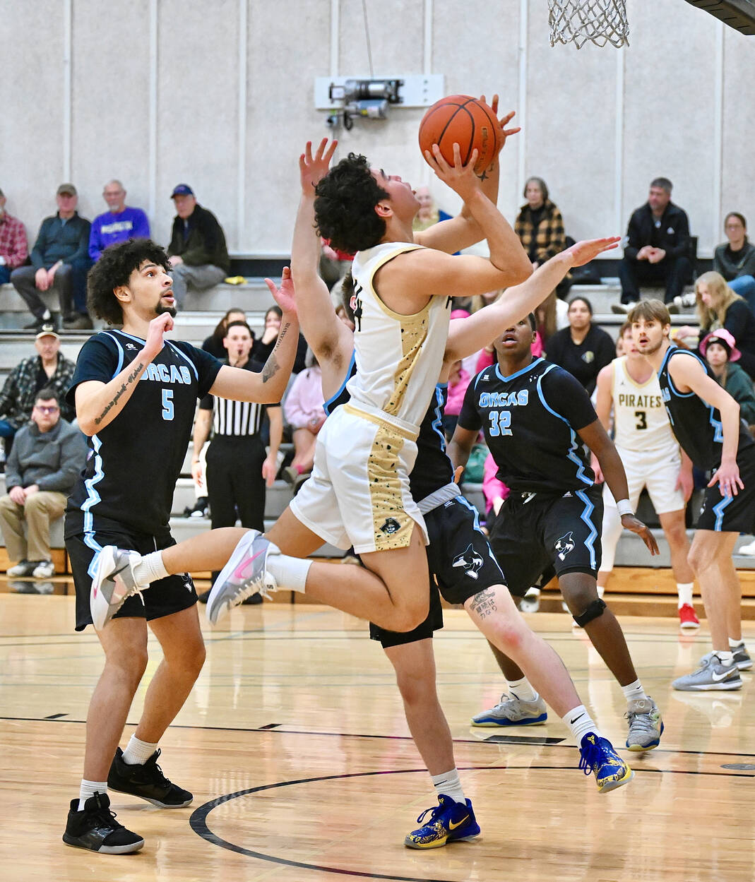 ay Cline/Peninsula College Athletics Peninsula College’s Isaiah Lopez absorbs contact while shooting the ball during the Pirates’ 97-74 NWAC North Region men’s basketball victory Wednesday night.