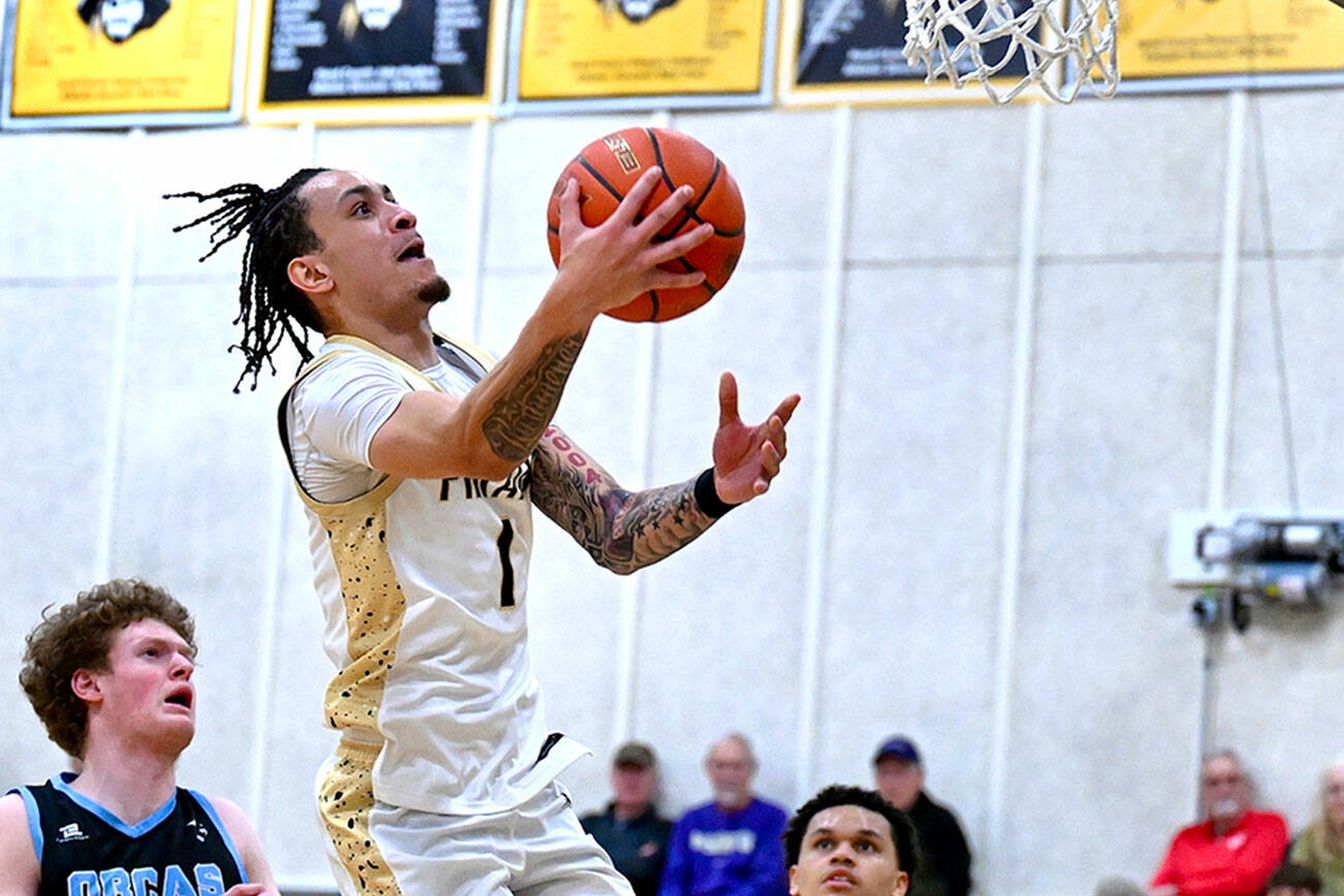 ay Cline/Peninsula College Athletics
Peninsula College's DeShawn Rushmeyer rises for a layup during the Pirates' 97-74 NWAC North Region men's basketball victory Wednesday night.