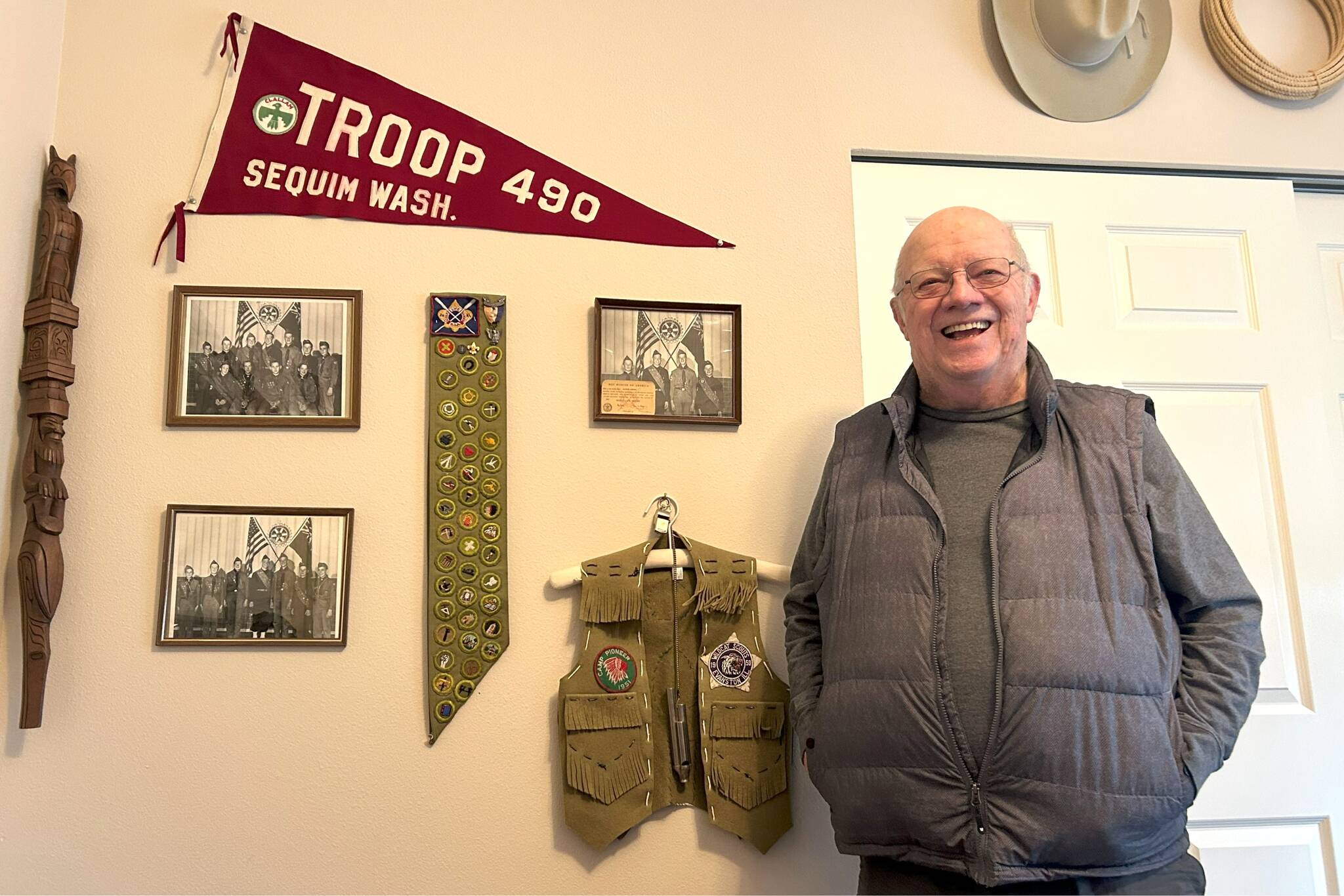 Matthew Nash / Olympic Peninsula News Group
Rick Godfrey stands with his Boy Scouts of America achievements on his office’s wall, including his merit badges and Troop 490 photos. In 1950, he was the youngest scout in the state to earn his Eagle Scout, the highest rank in scouting. The troop celebrated 100 years at a special dinner on Saturday at the Sequim Masonic Lodge.