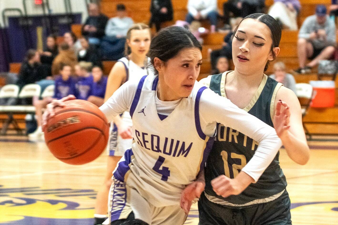 Sequim’s Gracie Chartraw dribbles against North Kitsap on Friday in the Wolves’ final home game of the year. (Emily Mathiessen/Olympic Peninsula News Group)