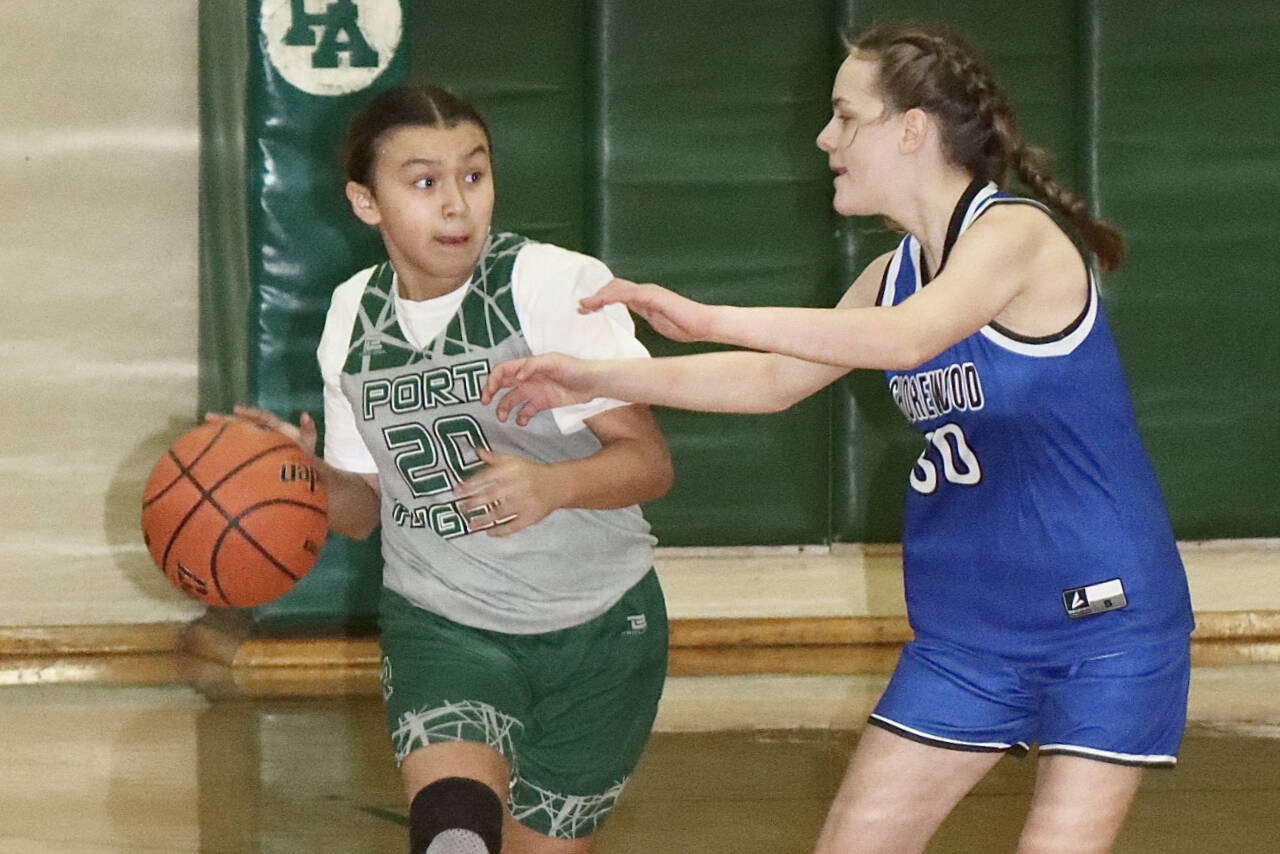 The Presidents’ Day Basketball Youth Tournament was held this weekend in Port Angeles with 40 teams coming from as far away as Elma, Sedro-Woolley, Belfair and Forks. Boys and girls teams had players in grades four through eight. Here, KaLeah Quilt of the seventh-grade Port Angeles girls team dribbles up the court against Shorewood. Shorewood won 22-21 on a last-second shot. (Dave Logan/for Peninsula Daily News)