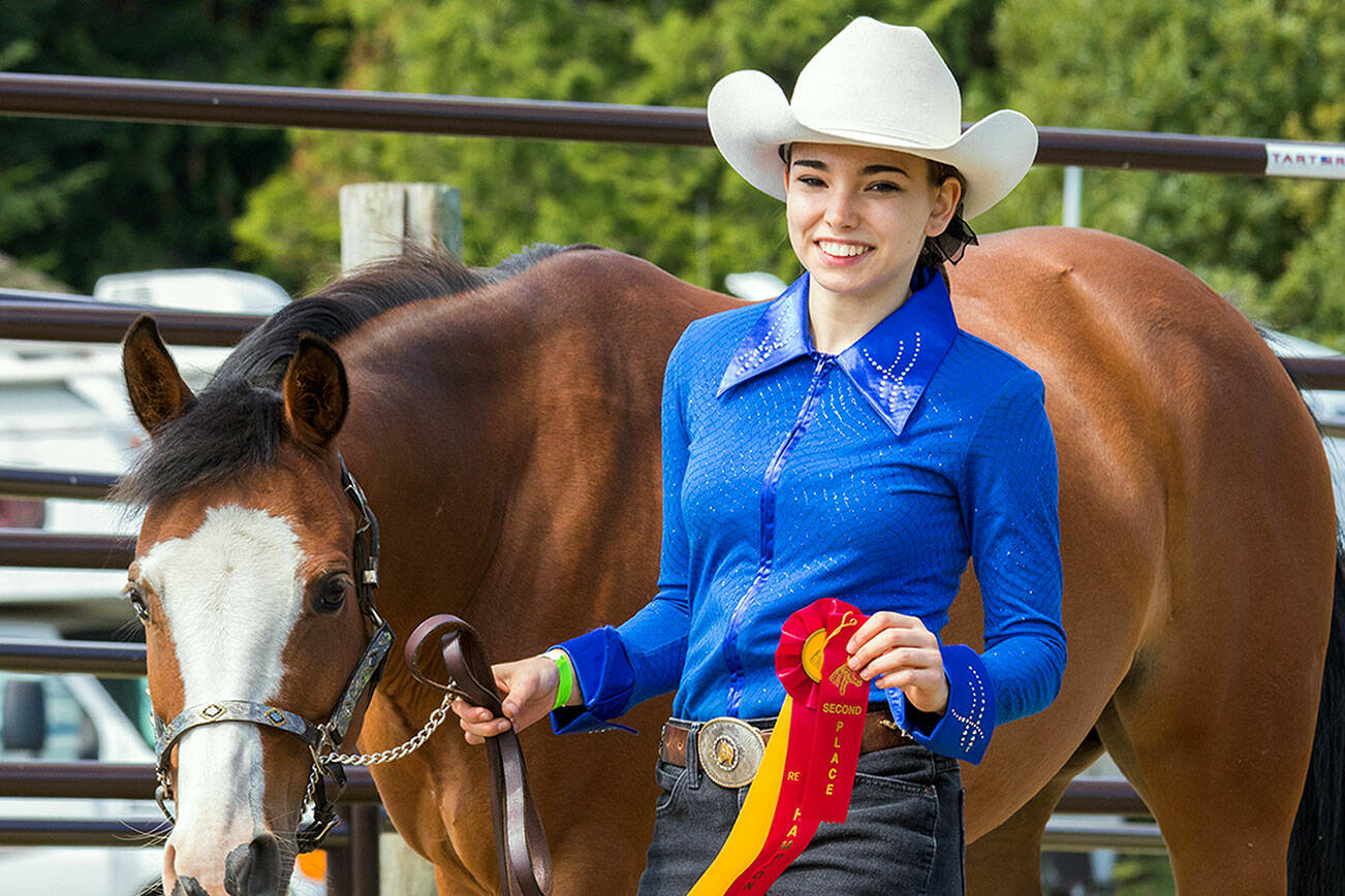 Submitted photo

A happy Hannah Grace Nordstrom, with Carolina, exit their halter class with ribbons in hand at the JeffCo Fairgrounds 4-H show in 2018.