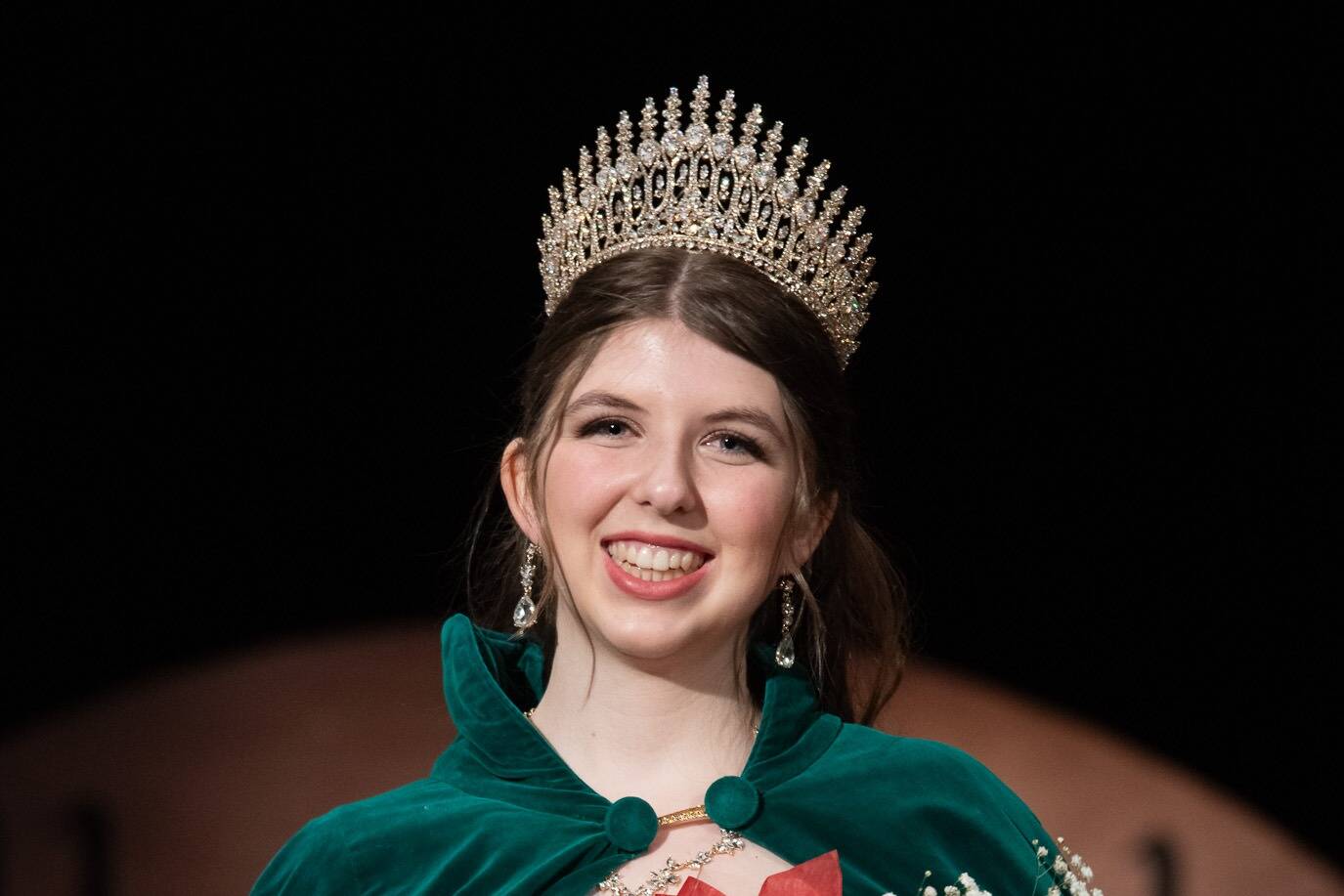 The 130th Irrigation Festival’s queen, Lily Tjemsland, receives her crown after participating in the scholarship pageant, which included a monologue performance, a dance routine with her fellow contestants and answering questions, both on stage and off. (Emily Matthiessen/Olympic Peninsula News Group)