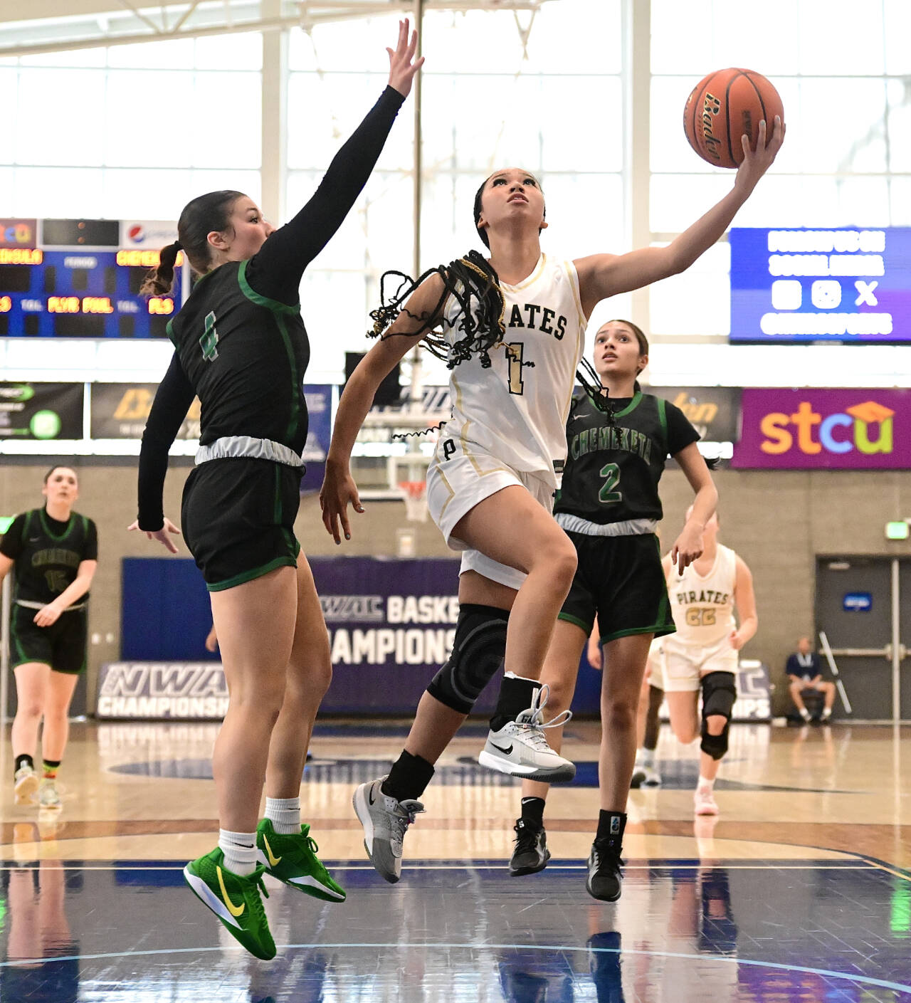 Peninsula College’s Carliese O’Brien drives to the hoop against Chemeketa’s Ava Rubio (4) and Mady Diaz (2) in the first round of the NWAC tournament at Columbia Basin College in Pasco. Peninsula got up 36-5 at the half and went on to win 66-44. (Jay Cline/Peninsula College)