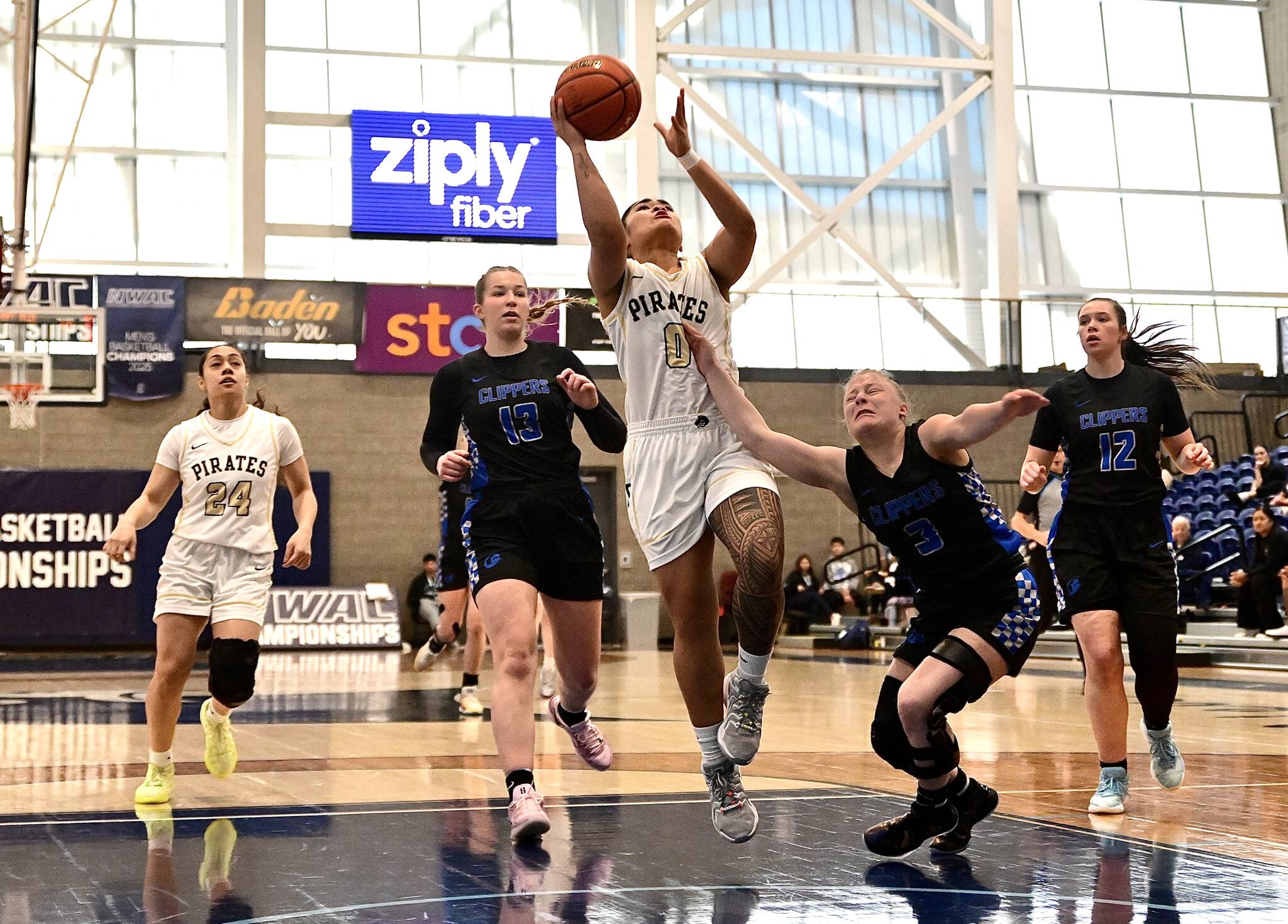 Jay Cline/Peninsula College Athletics 
Peninsula College’s Ciera Tugade Agasiva cuts through the South Puget Sound defense and gets to the rim for a layup during the Pirates’ NWAC women’s basketball tournament Elite 8 victory Thursday at Columbia Basin College in Pasco.
