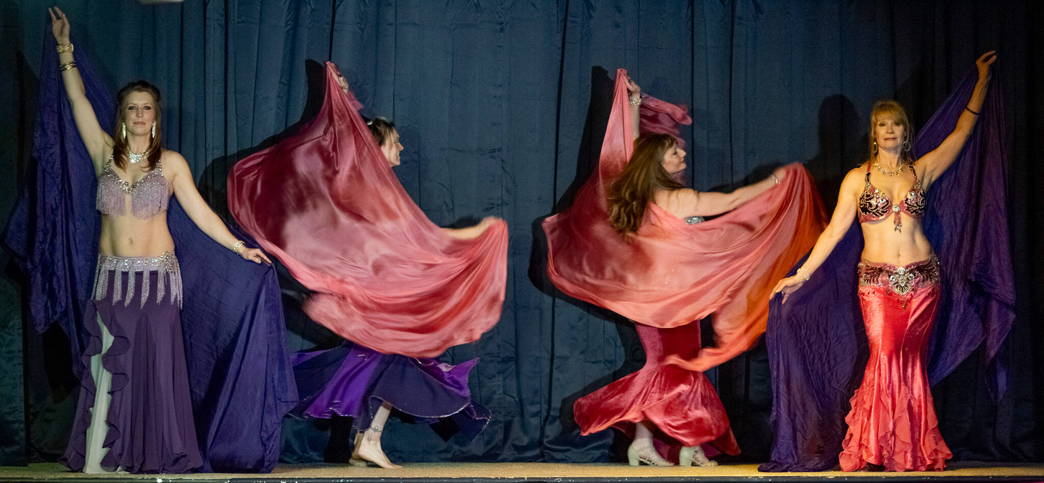 Belly dance troupe Shula Azar, from left, Marie Maxted, Jovi Wilson, Laura Samperi-Ferdig and Denise Williamson, perform for a full house at Studio Bob on Feb. 21. (Emily Matthiessen/Olympic Peninsula News Group)