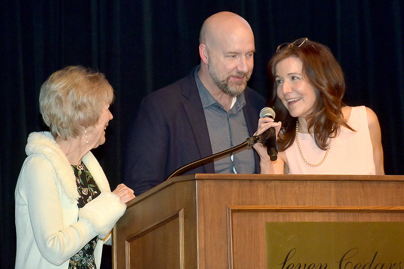 Family members of the late Mike McAleer, from left, McAleer’s wife, Shannon Burke, son Michael McAleer and daughter Colleen McAleer, accept the Clallam Economic Development Council’s Olympic Leader Award at Friday’s annual EDC Gala at 7 Cedars Casino in Blyn. (Keith Thorpe/Peninsula Daily News)