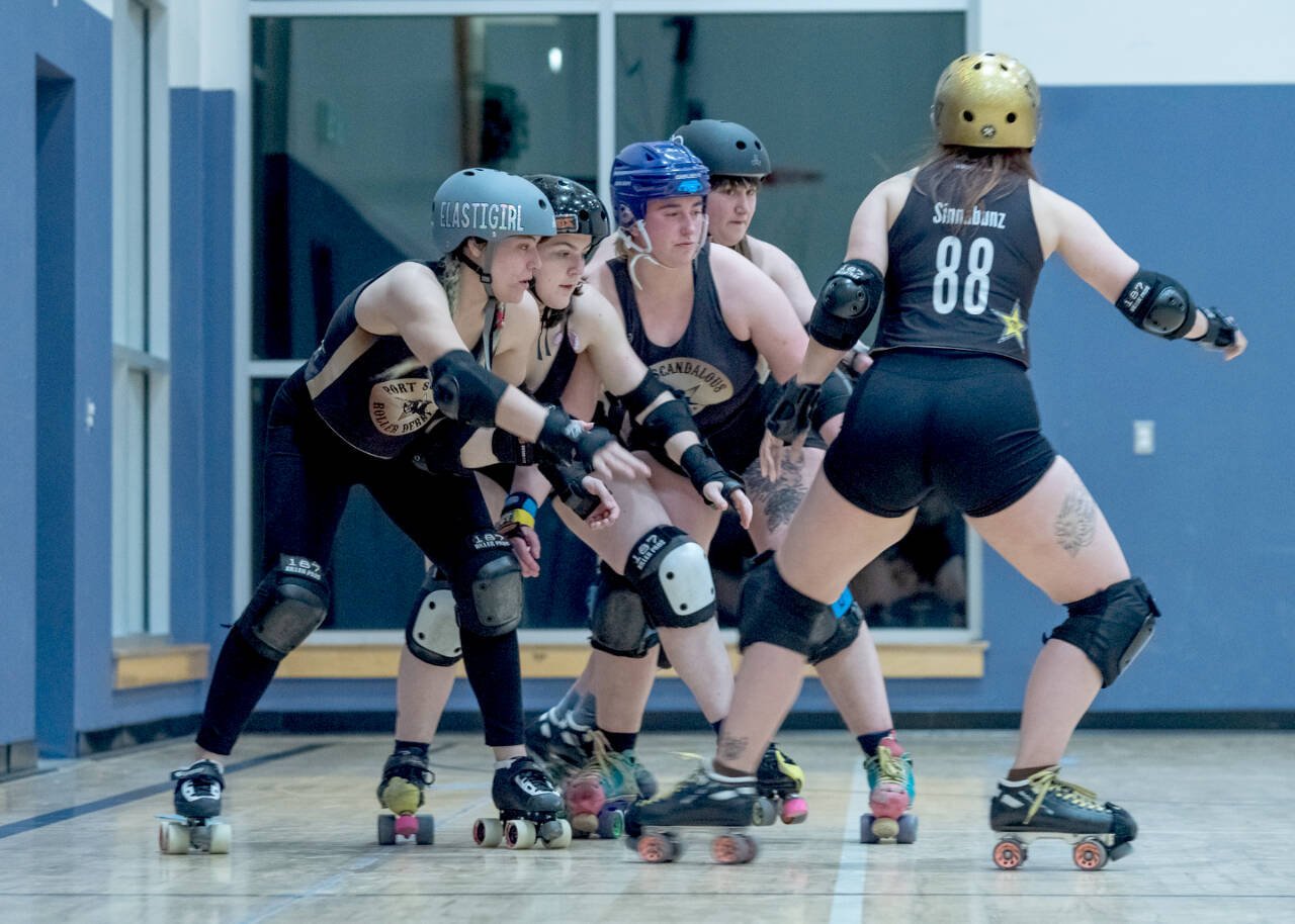 Members of the Port Scandalous Roller Derby squad practice in Sequim during the winter to get ready for the season. (Emily Matthiessen/Olympic Peninsula News Group)