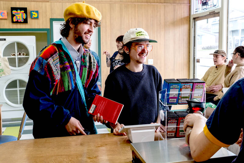 Customers check out at The Pine and Eight, a local goods-only grocery store co-owned by SisterLand Farms and Northwest Beach Work. This store, which recently opened at 511 W. Eighth St. in Port Angeles, is an experiment testing out the viability of a farmer- and artisan-owned store selling Washington-only products. (Eli Smith)