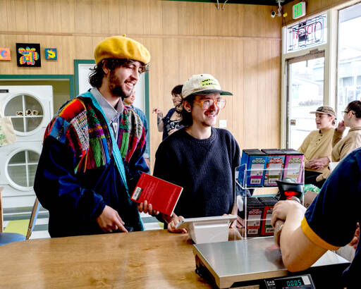 Customers check out at The Pine and Eight, a local goods-only grocery store co-owned by SisterLand Farms and Northwest Beach Work. This store, which recently opened at 511 W. Eighth St. in Port Angeles, is an experiment testing out the viability of a farmer- and artisan-owned store selling Washington-only products. (Eli Smith)