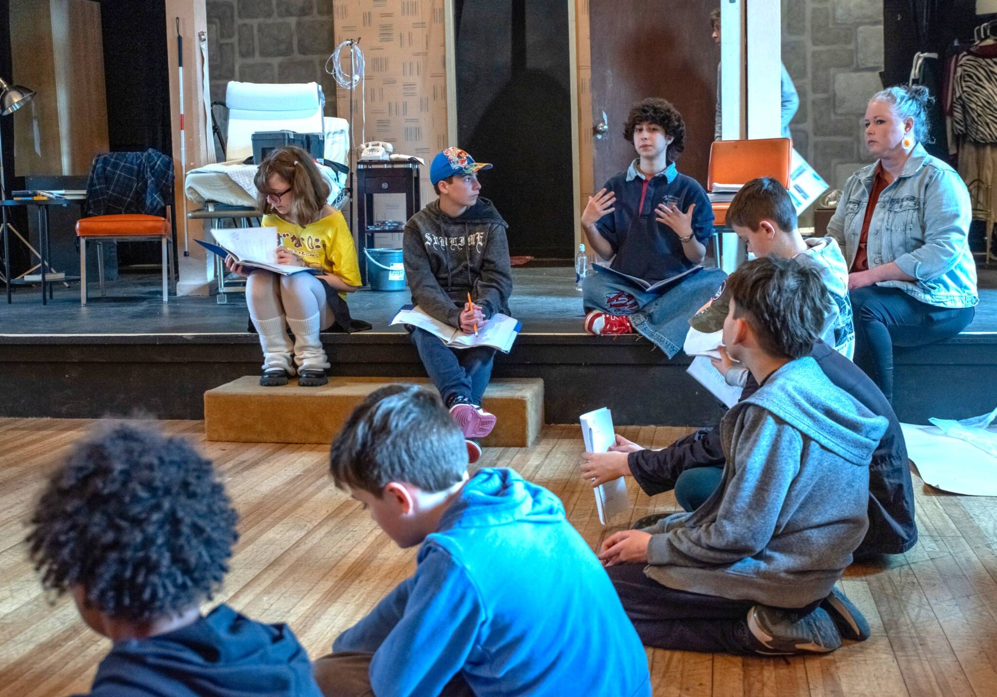 Emily Matthiessen/Olympic Peninsula News Group
From left to right, student directors Rayna Loree, Paco Struve and Charlie Medlong (mentor Carolyn Edge to the right) coach young thespians during Olympic Theatre Arts’ spring break theater skills program, which culminated in two Saturday performances of “Stones” by playwright Colleen Neuman.
From left to right, student directors Rayna Loree, Paco Struve and Charlie Medlong (mentor Carolyn Edge to the right) coach young thespians during Olympic Theatre Arts’ spring break theater skills program, which culminated in two Saturday performances of “Stones” by playwright Colleen Neuman. (Emily Matthiessen/Olympic Peninsula News Group)