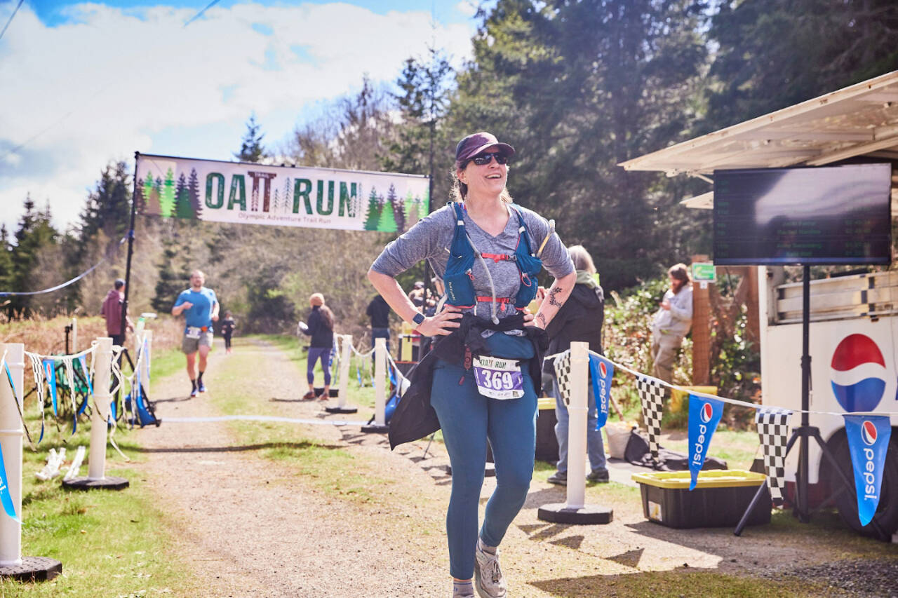 Rachel Hardies of Port Angeles finishes the half-marathon at this year’s Olympic Adventure Trail Run, which took place in near-perfect sunny conditions this weekend. (Matt Sagen/Cascadia Films)