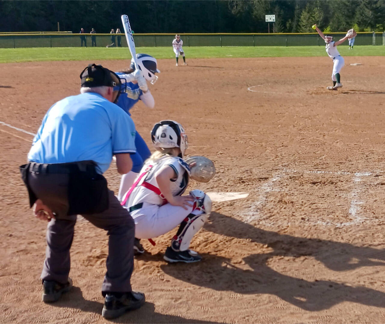 Port Angeles pitcher Lynzee Reid delivers a pitch to catcher Persephone Perry in Monday's 17-0 victory over Bremerton. Reid and Heidi Leitz combined for a one-hitter, striking out nine in just five innings. (Pierre LaBossiere/Peninsula Daily News)