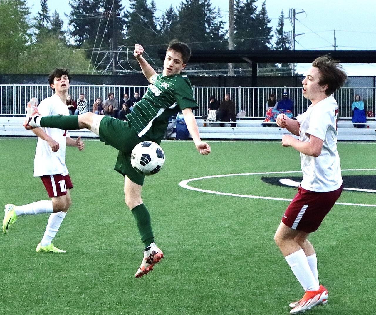Port Angeles’ Kanyon Anderson battles for a ball against Kingston on Friday. The Roughriders won their fourth league game in a row 4-2 over the Buccaneers, putting their record at 6-2 in league. (Dave Logan/for Peninsula Daily News)
