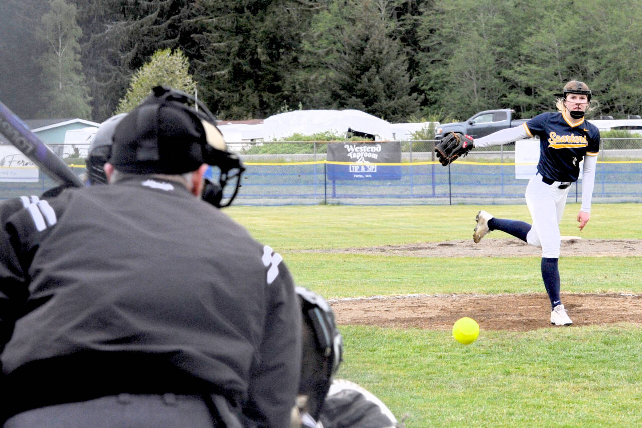 Forks' Bailey Johnson delivers a pitch to an Ilwaco batter Tuesday in Forks. Johnson hit two home runs on the day and was part of a no-hitter in the second game of a doubleheader as Forks swept the Fishermen. (Lonnie Archibald/for Peninsula Daily News)