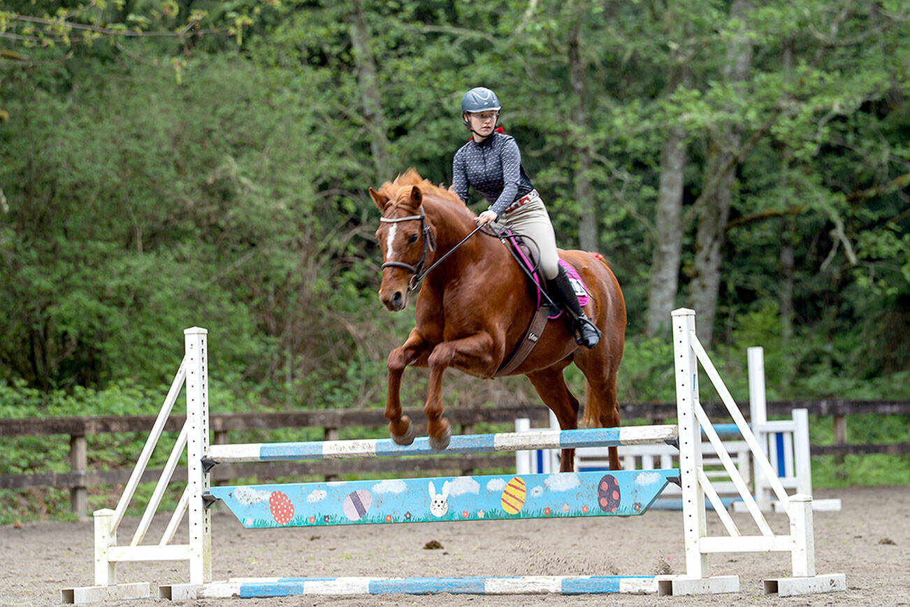 Kimi Robertson
Freedom Farm Hoof Beats member Lily Robertson and her horse Queen of Hearts (Ruby) showed excellent style and form, placing first in the 95-meter jumper class at the Bainbridge Saddle Club’s first Hunter/Jumper Show of the season.