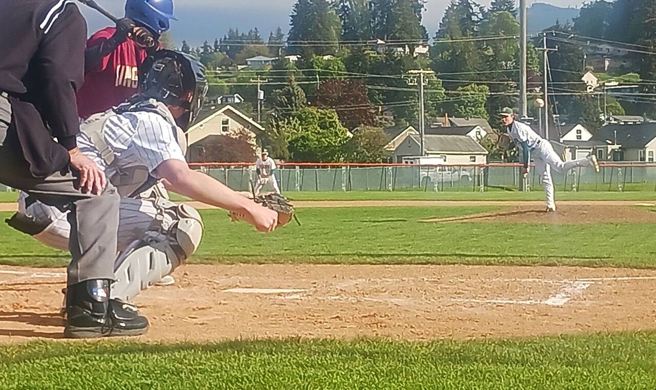 Port Angeles’ Hunter Stratford pitches against Kingston at Civic Field on Wednesday. The Roughriders prevailed in nine innings in windy conditions 7-6 to finish the regular season in third place in the Olympic League at 8-6. (Pierre LaBossiere/Peninsula Daily News)
