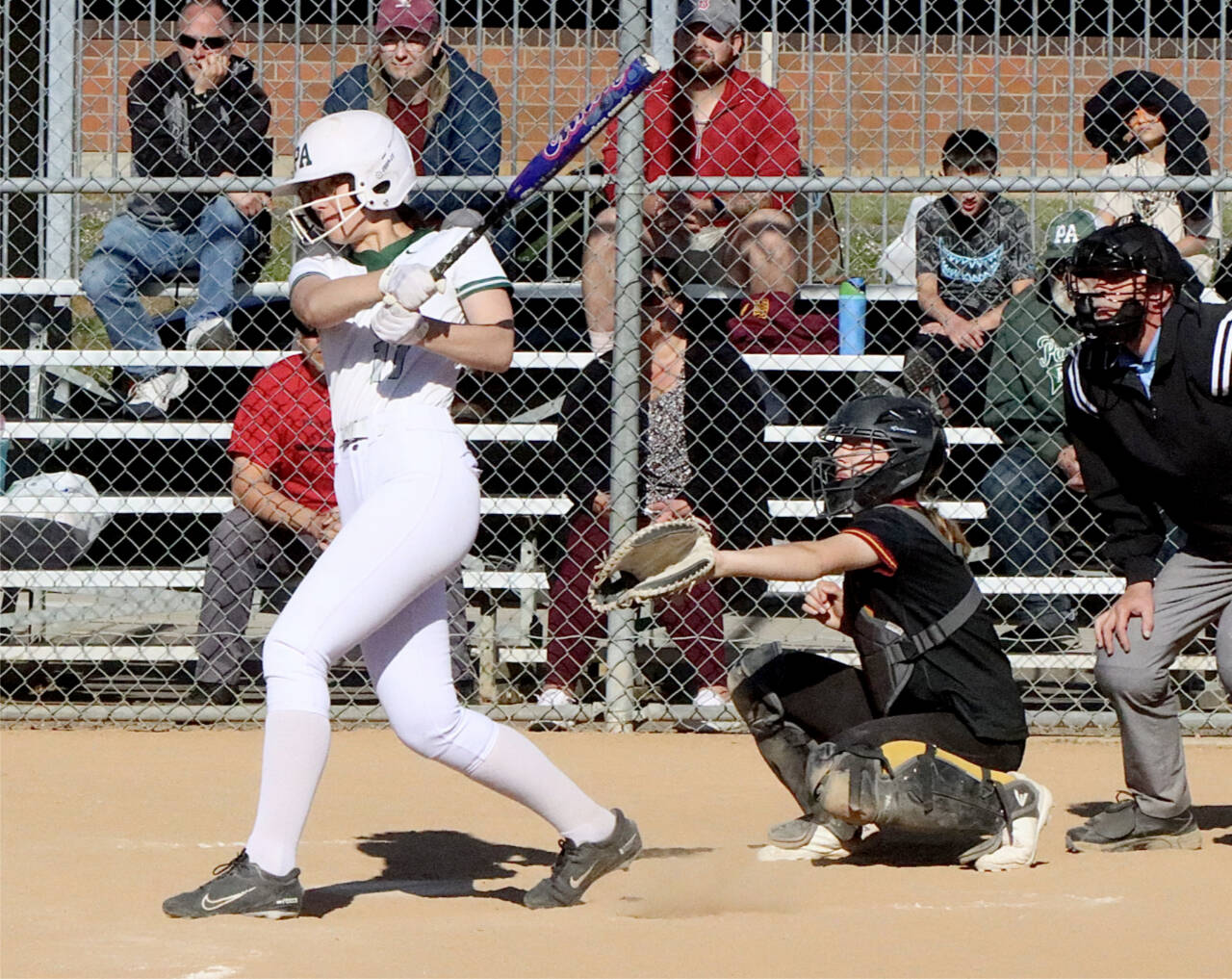 Port Angeles’ Lexie Smith went 4-for-4 with a home run against Kingston as the Roughriders won 10-1 to win sole possession of first place. (Dave Logan/for Peninsula Daily News)