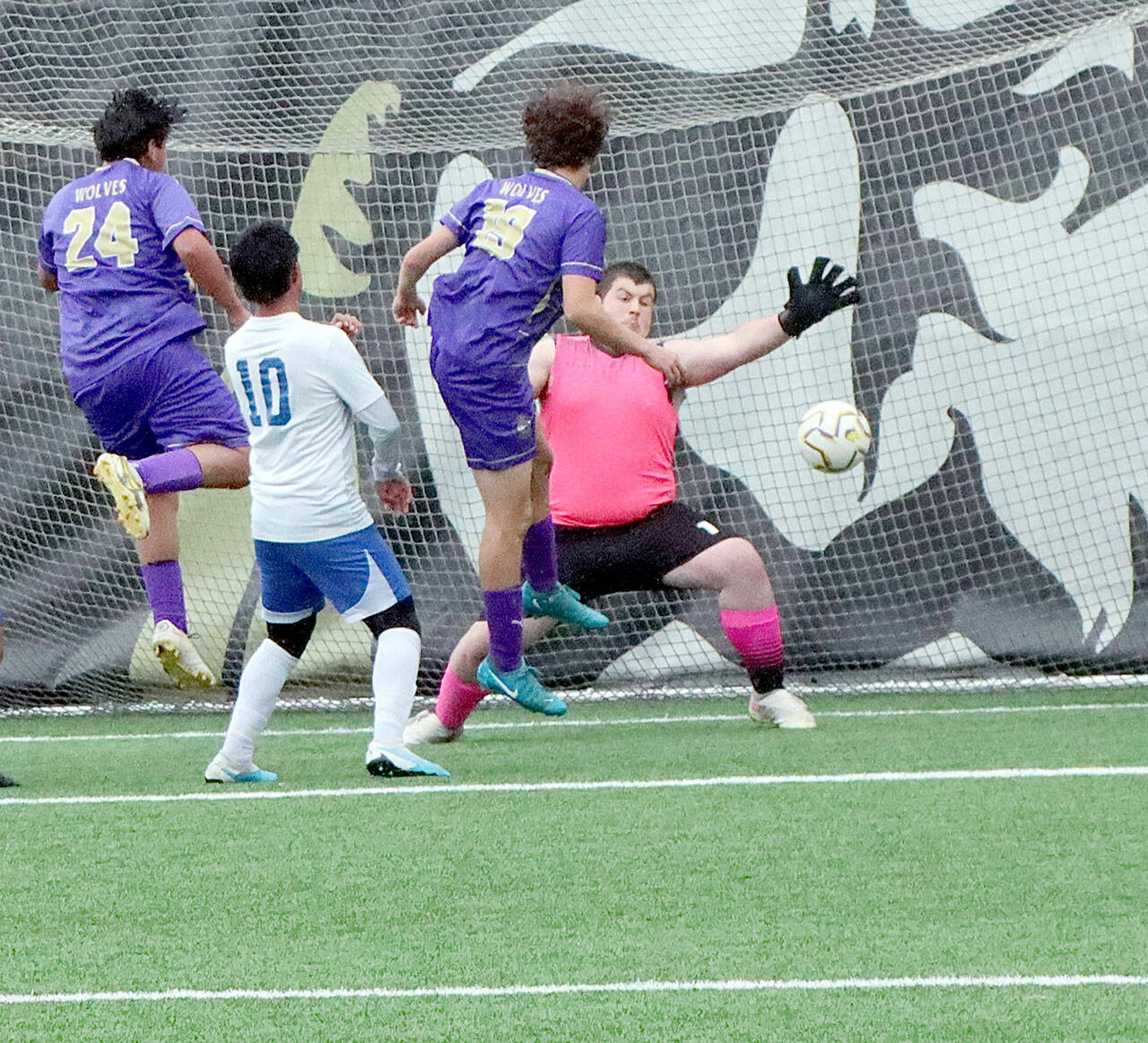 Sequim’s Nico Musso, third from left, scores the second goal the Wolves’ 2-0 Class 2A West Central District Tournament victory over Bremerton on Thursday at Peninsula College’s Wally Sigmar Field. (Dave Logan/for Peninsula Daily News)