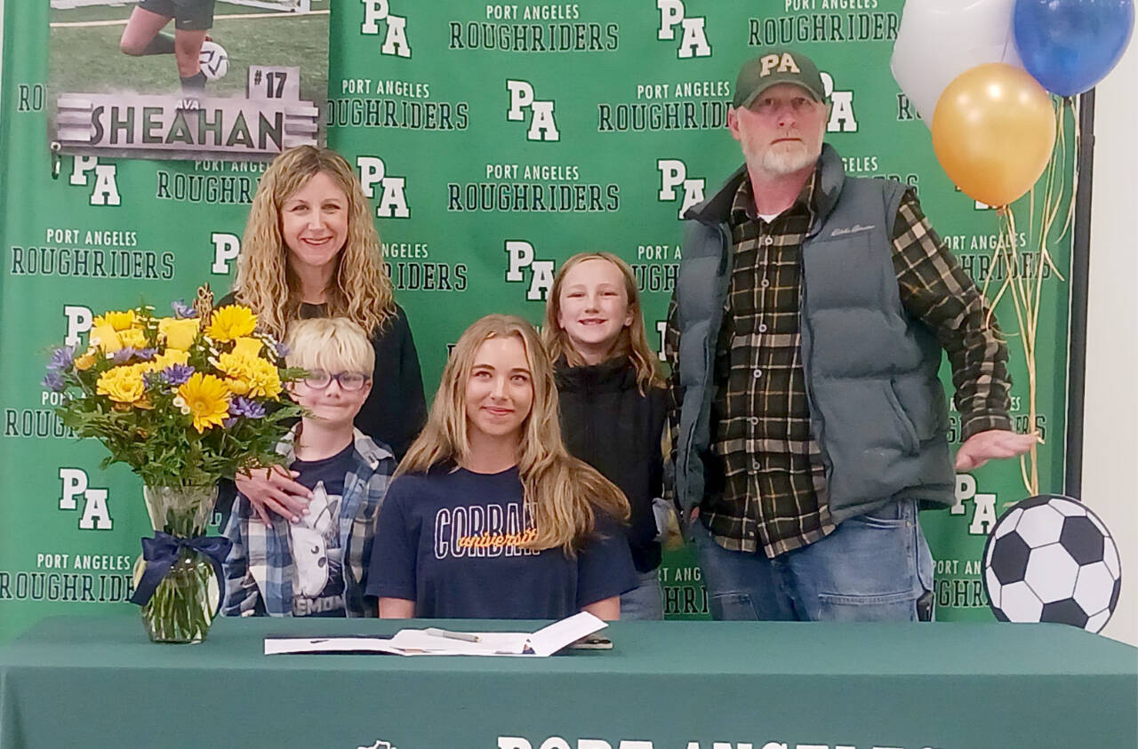 Port Angeles’ Ava-Anne Sheahan signed to play soccer for Corban University in Salem, Ore., last week surrounded by her family, from left, mother Megan Shean, brother Axel Johnston, sister Addy Johnston and father Bucky Johnston. (Pierre LaBossiere/Peninsula Daily News)