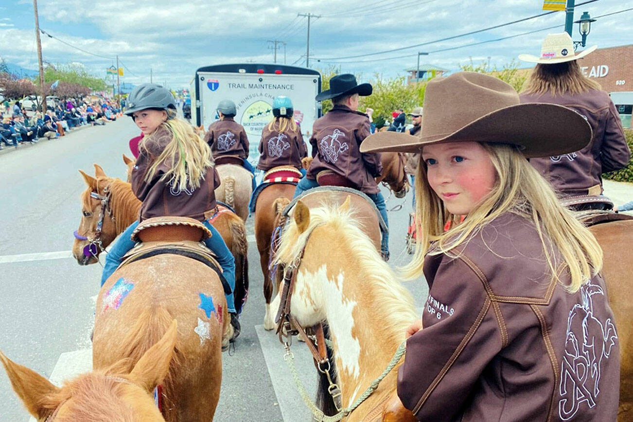 Kendra Fors
Peninsula Junior Rodeo’s participants in Sequim’s Irrigation Festival Grand Parade included Kenzie Fors (wearing cowboy hat) and Skylar Burgett (helmet).