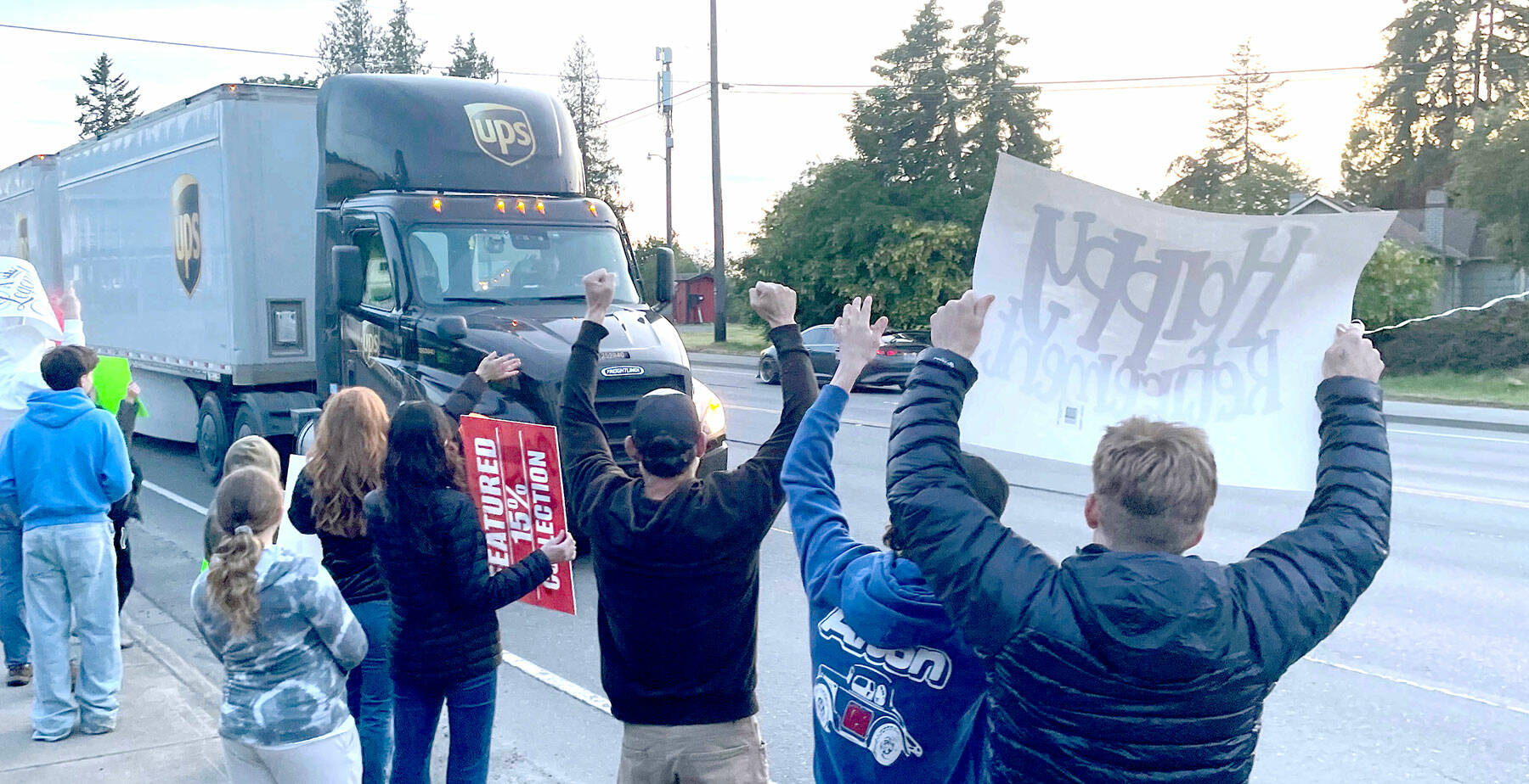 Family, friends and co-workers give Corey Alton a spirited send-off to celebrate the final shift of the Port Angeles driver’s 36 years with UPS. Alton drove about 3.6 million miles over the course of his career without an accident or a ticket. (Paula Hunt/Peninsula Daily News)