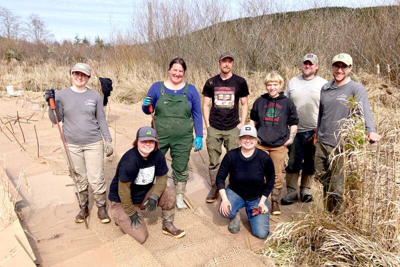 Northwest Watershed Institute’s field restoration crew, from left to right, are Megan Brookens, Grace Burke, Hanna Petersen, Bernt Goodson, Eva Ellis, Veronica Phelan, Zach Hawkes and Wesley Meyers. They worked at a restoration site at the Tarboo Wildlife Preserve. (Northwest Watershed Institute)