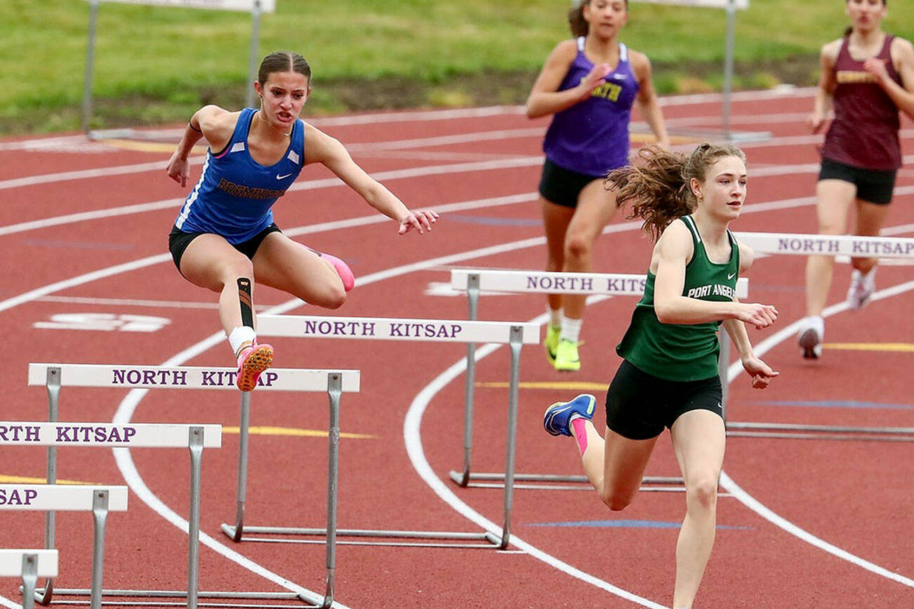 Port Angeles' Faerin Tait, front, runs in the hurdles during the Olympic League Championships at North Mason High School. Tait will compete in four events at the Class 2A State Track & Field Championship this weekend.