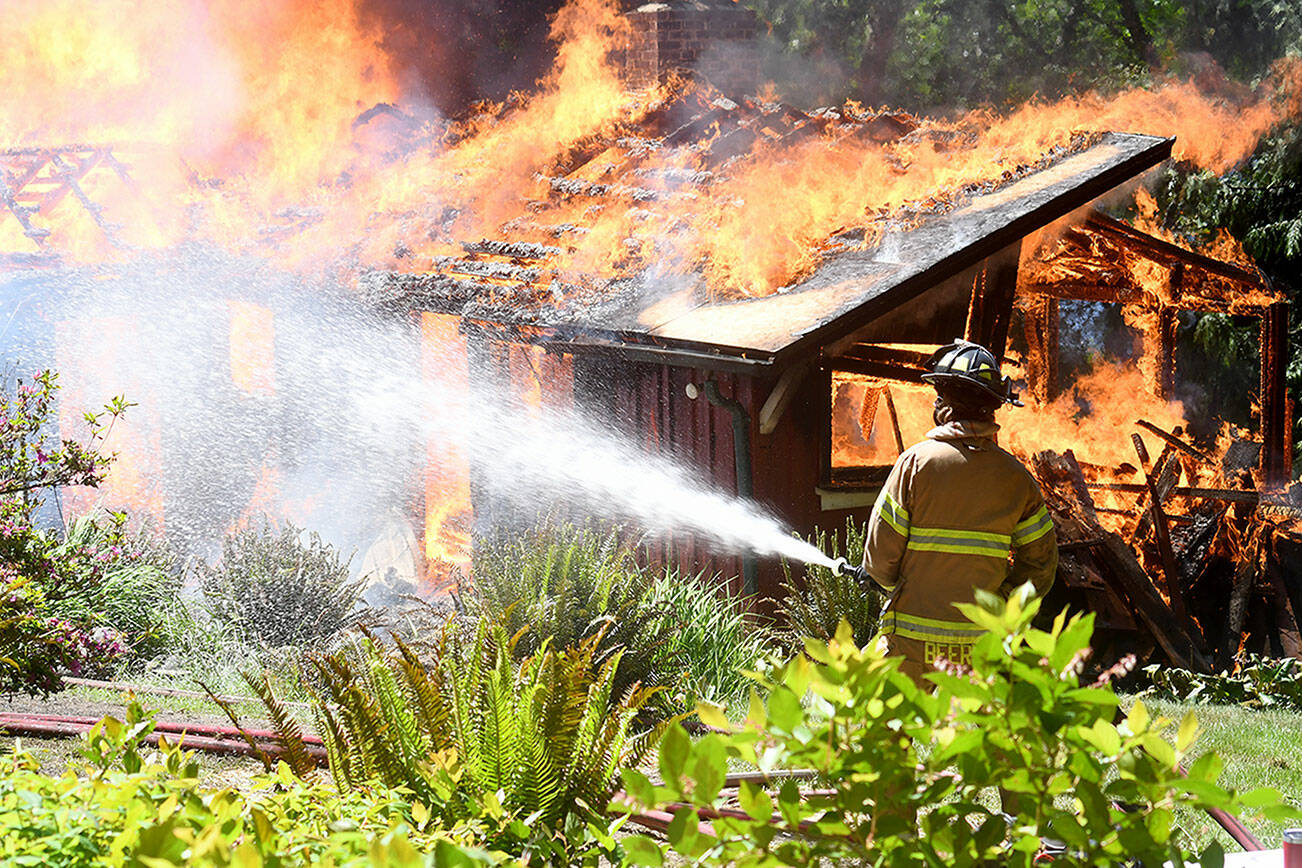 A 1949 built cabin at Lake Gibbs in Chimacum, was used for a live structure fire training by East Jefferson Fire Rescue Wednesday. (East Jefferson Fire Rescue)