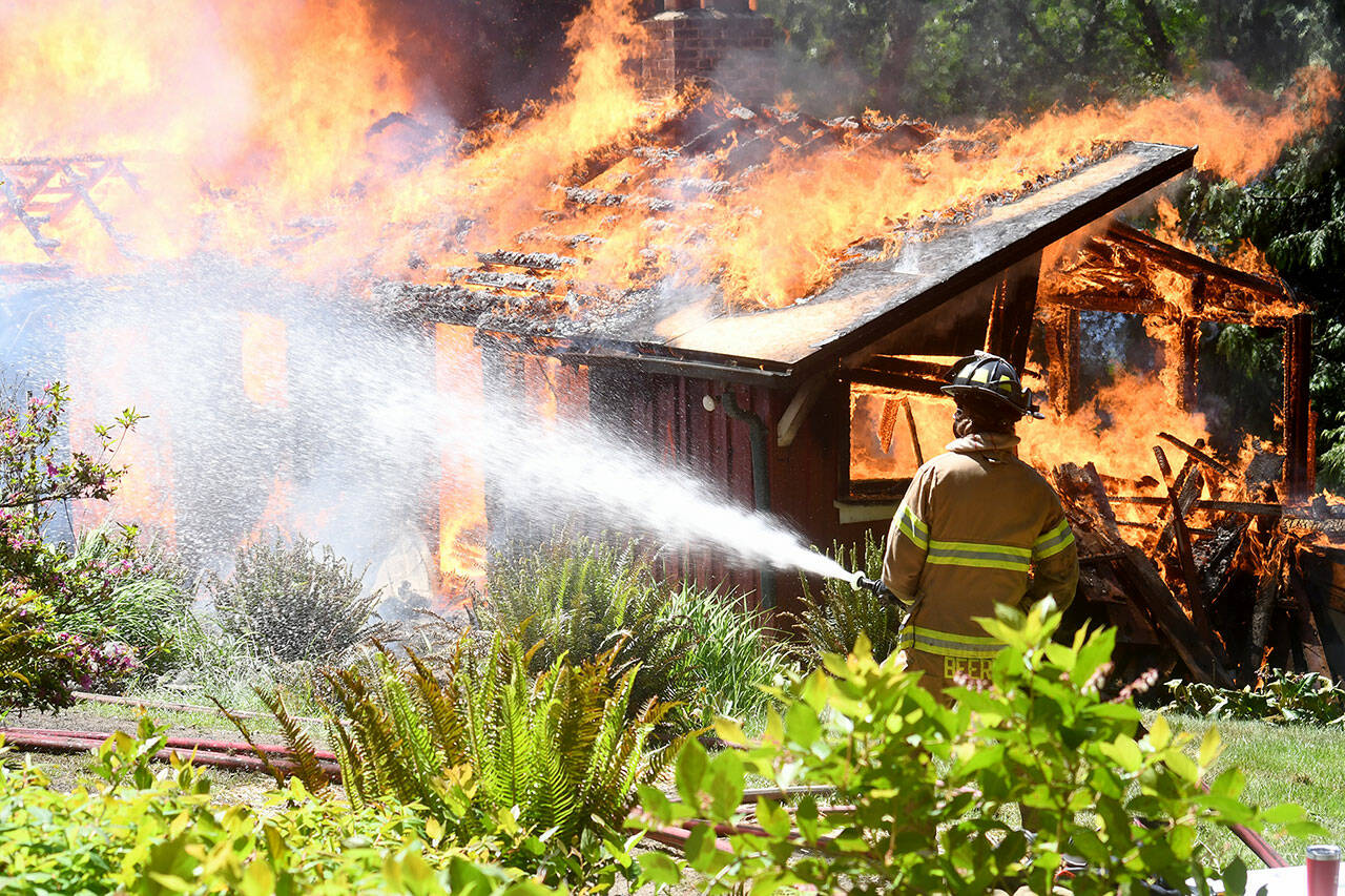 A 1949 built cabin at Lake Gibbs in Chimacum, was used for live structure fire training by East Jefferson Fire Rescue on Wednesday. (East Jefferson Fire Rescue)