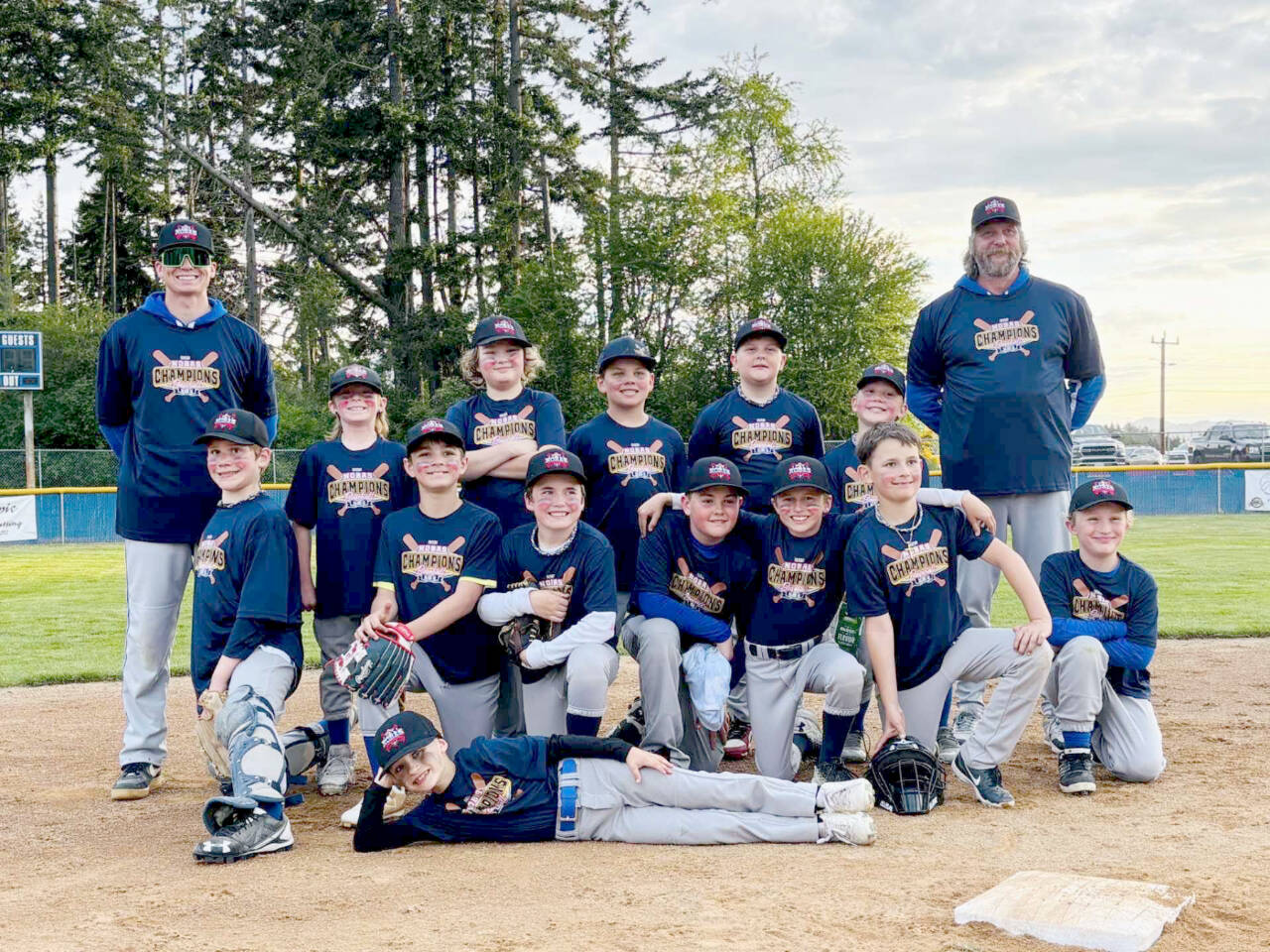 The Rotary Club team won this weekend's North Olympic Baseball and Softball baseball championship for the U12 Majors 46/60 league. From left, back row are coach Joel Wood, Skyler Neitzel, Bjorn Rose, Sawyer Almond, Gabriel Money, Joshua Shiepko and Coach Simon Money. From left, bottom row, are Gabriel Shiepko, Steven Torres, Samuel Jones, Jace Baker, August Jones, Raylan Gear and Damien Millet. Lying sideways is Reed Lancaster.