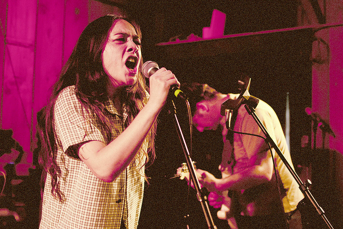 Helen and Richard “Rico” Vinh of the band Pistil play onstage at the first Tarboo Fest on July 4, 2024. (Elijah Sussman/Peninsula Daily News)