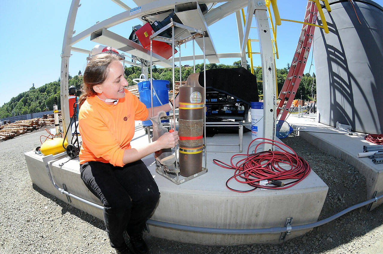 Oceanographer Mallory Ringham makes adjustments on a carbon dioxide sensor that will be deployed in Port Angeles Harbor. (KEITH THORPE/PENINSULA DAILY NEWS)