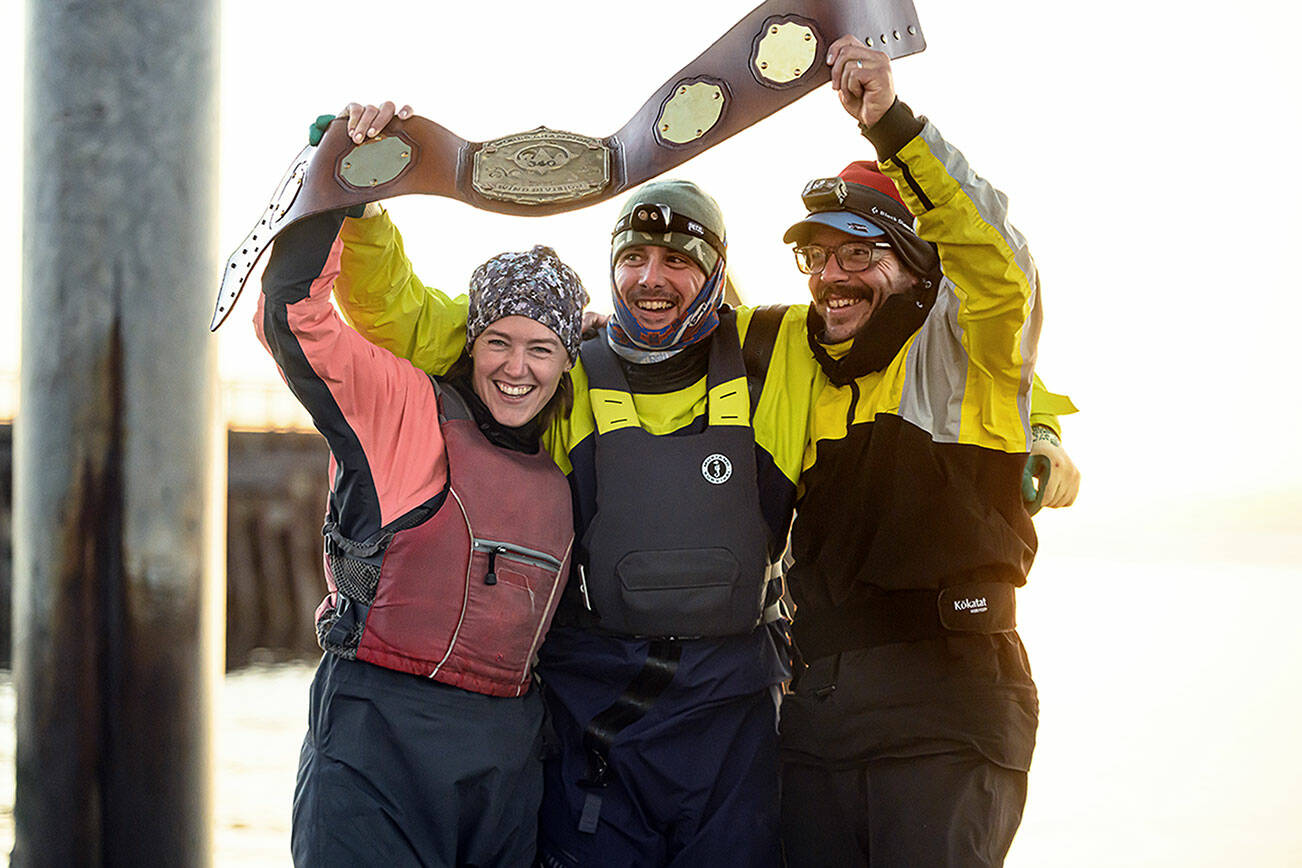 Team Puget Sound Navigation Company from left to right; Molly Karas, Michael Karas and Anthony Boscolo celebrating with their champion belt, July 1. (Photo credit: Jim Meyers)