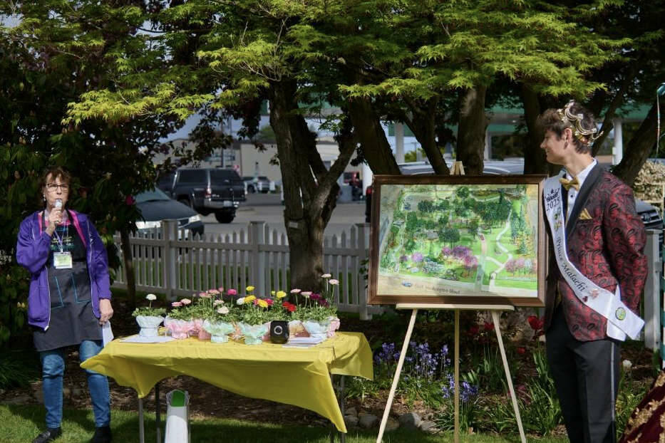 Suzan Mannisto, co-manager of Pioneer Memorial Park, introduces the “Pathway Accessible to All Project” as Sequim Irrigation Festival Prince Malachi Byrne looks on. (Sequim Prairie Garden Club)