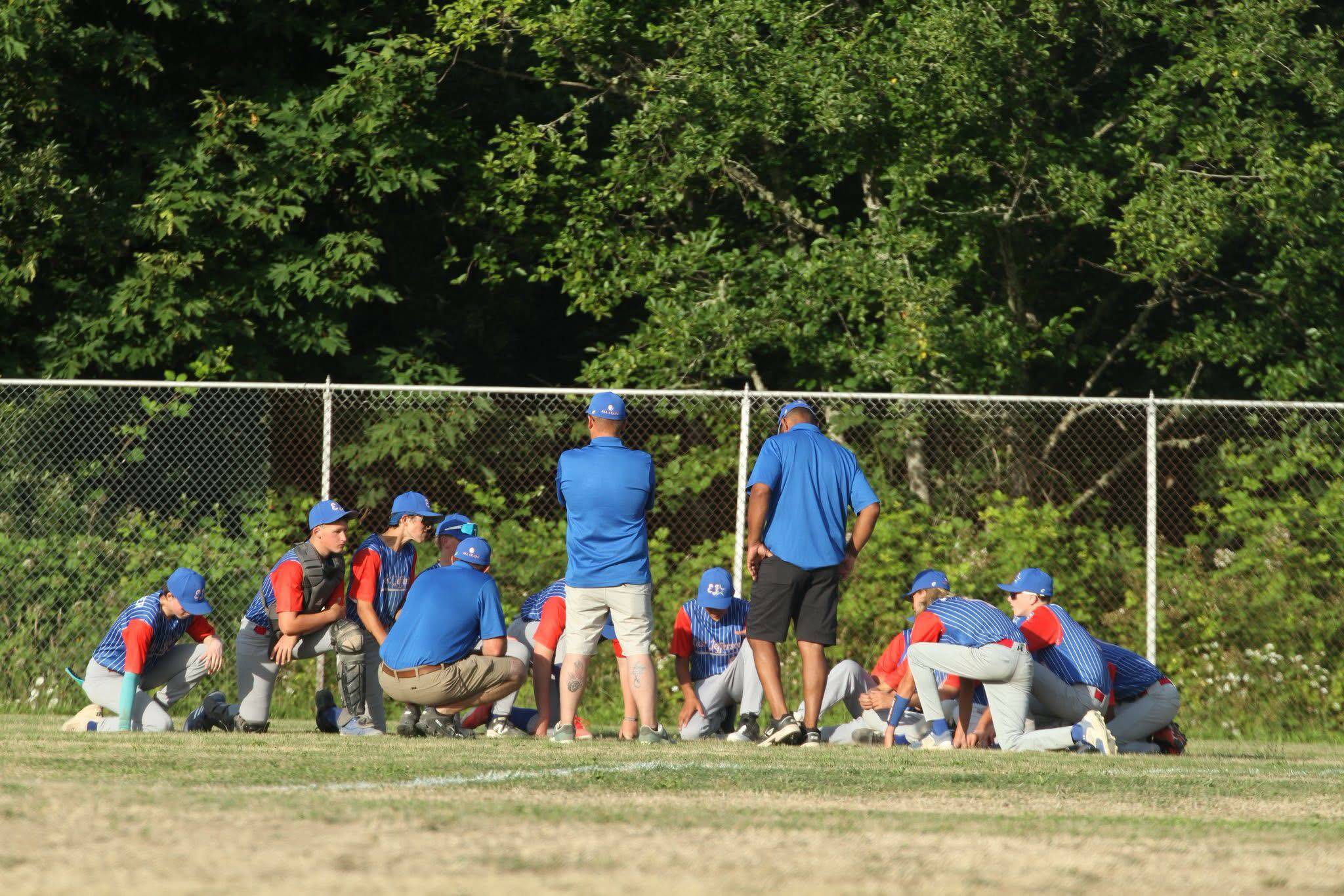 East Jefferson coaches and players talk after the team opened the 2025 Washington State Juniors State Tournament with a17-0 win over Montesano over the weekend. East Jefferson is 2-0 so far in the tournament with a spot in the West Region Tournament in Bend, Ore. on the line. (The Aberdeen Daily World)