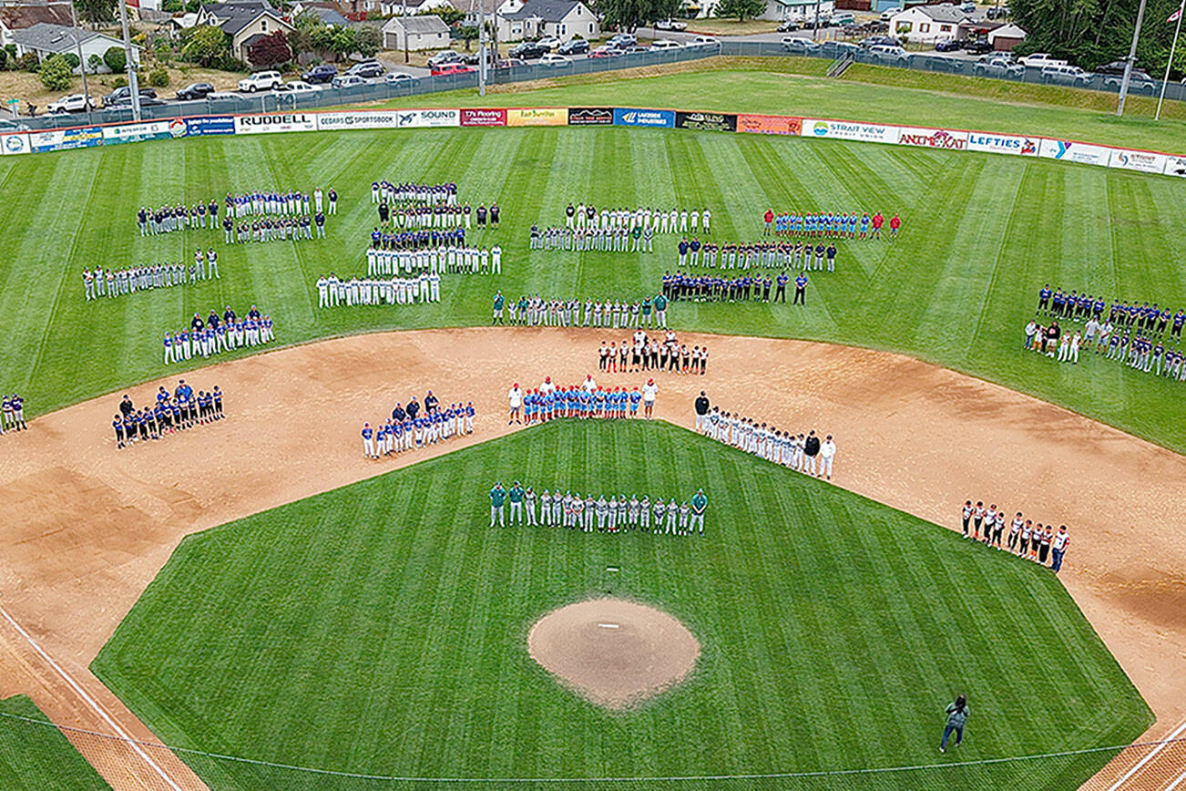 Civic Drone
Courtesy Eric Johnson
Teams line up on the Civic Stadium diamond for the Northwest Washington Cal Ripken State Championships' opening ceremony Wednesday evening. Port Angeles is hosting the championships for the first time in 20 years. Organizers expect the event to draw between 1,500 and 2,000 visitors, including families, coaches and officials.
