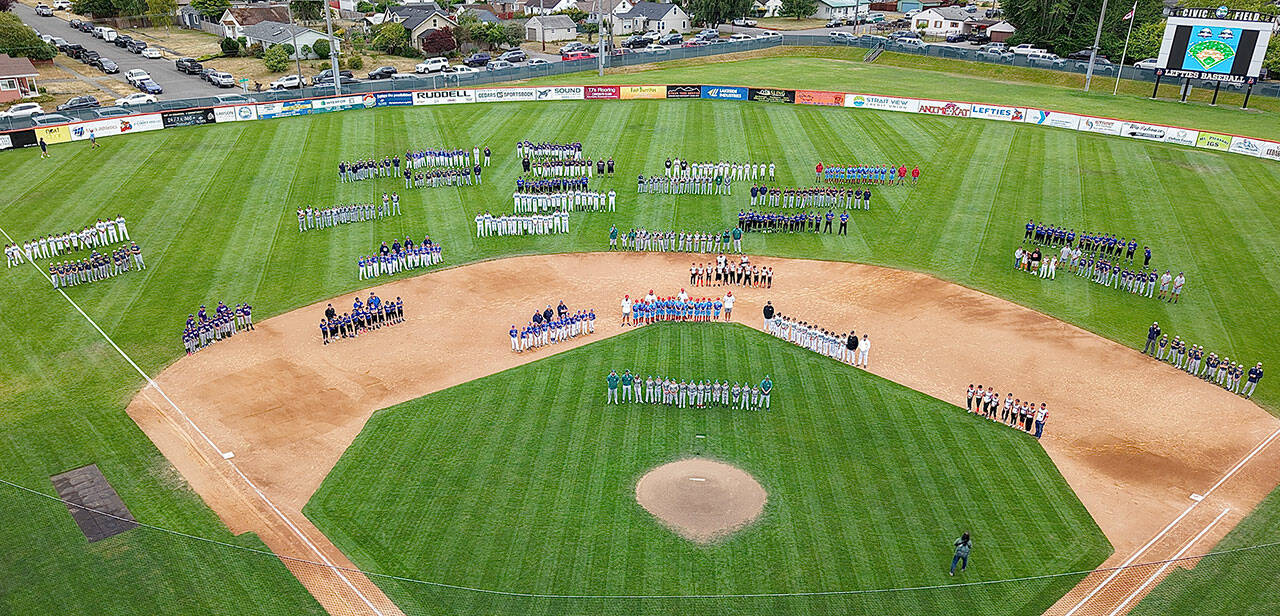 Civic Drone Courtesy Eric Johnson Teams line up on the Civic Stadium diamond for the Northwest Washington Cal Ripken State Championships’ opening ceremony Wednesday evening. Port Angeles is hosting the championships for the first time in 20 years. Organizers expect the event to draw between 1,500 and 2,000 visitors, including families, coaches and officials.