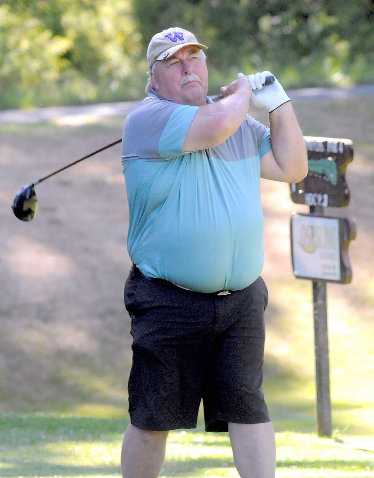 KEITH THORPE/PENINSULA DAILY NEWS
Brian Sleight of SeaTac tees off during the first round of the Clallam County Amateur at Peninsula Golf Club on Friday. The tournament continues today and will wrap Sunday at The Cedars at Dungeness Golf Course in Sequim.