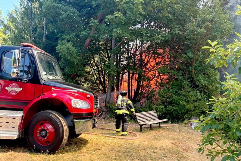 Firefighters work to contain a wildland fire on Tuesday afternoon near Brinnon. “Go now” evacuation orders were given from Jefferson County’s Emergency Operations Center. (Jefferson County Sheriff’s Office)