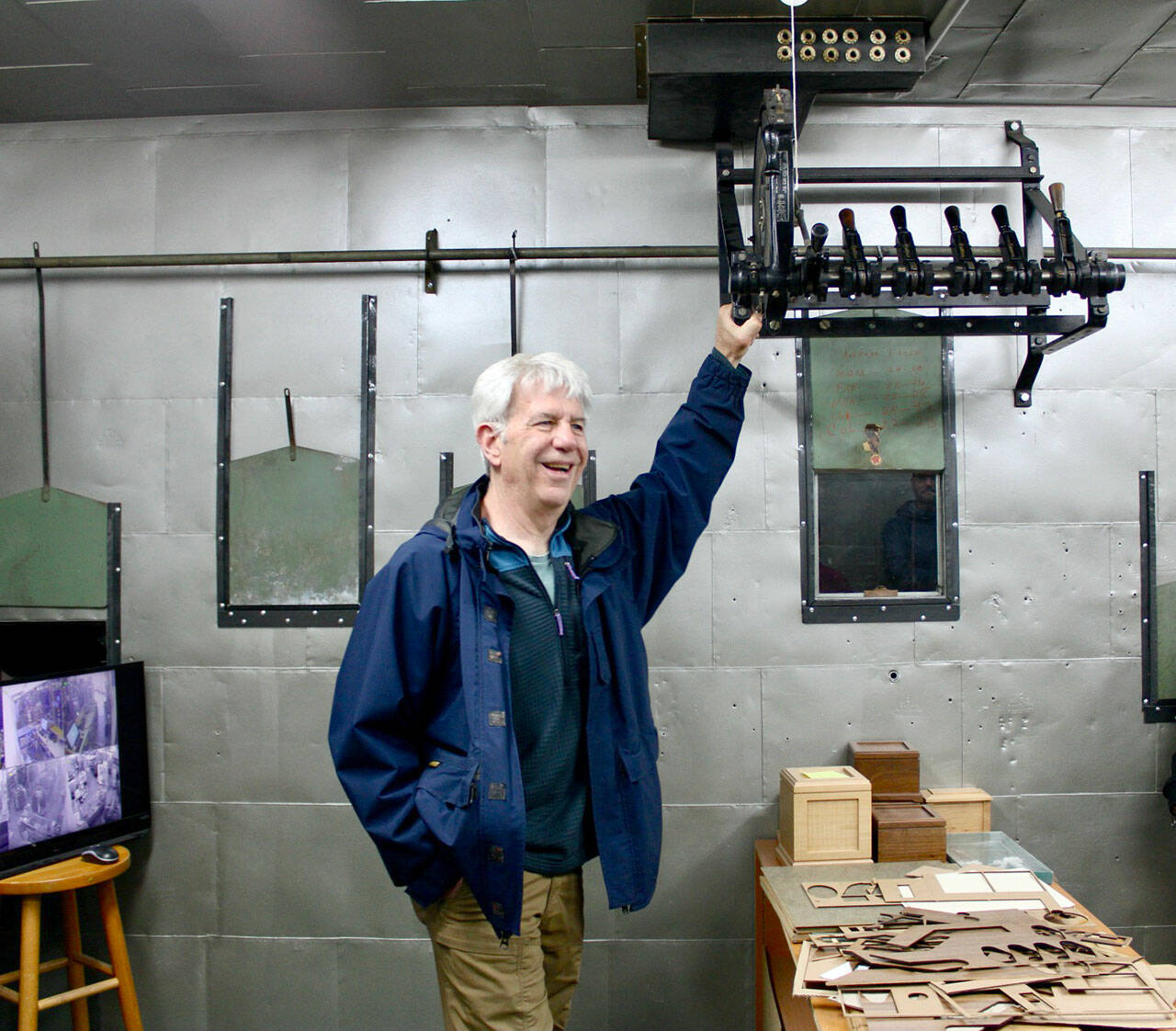 Tour guide Steve Hargis shares the history of a long-forgotten movie theater hidden above Captain T’s, offering a glimpse into Port Angeles’ early entertainment scene. (Allora Walls/Peninsula Daily News)