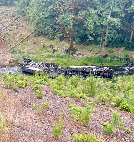A tanker truck overturned into Indian Creek west of Port Angeles, according to the State Patrol and the state Department of Transportation. U.S. Highway 101 was closed Friday afternoon at milepost 238 near Herrick Road, and traffic was being diverted to state Highway 112. (Katherine Weatherwax via X)