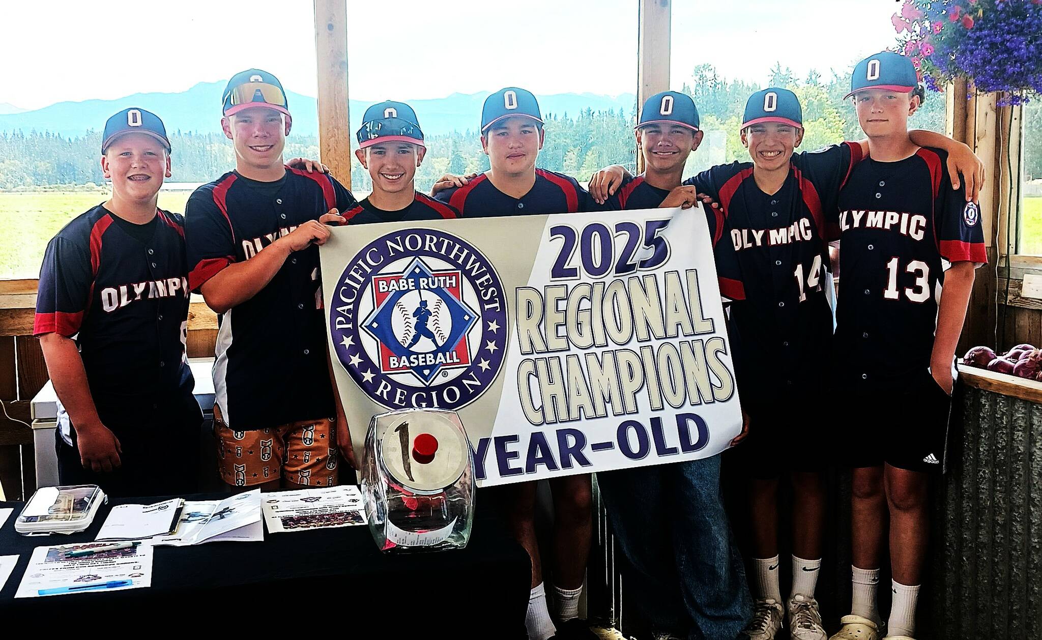 The North Olympic 13U team was at Agnew Grocery on Thursday holding a raffle to raise money to pay for their trip to play in the Babe Ruth 13U World Series in Jamestown, N.Y. There is also a GoFundMe at https://tinyurl.com/OlyWorldSeries. The Babe Ruth World Series begins on Aug. 16. From left are team members Cooper Merritt, Jacob Kimsey, Noah Kiser, Gavin Doyle, Tristan Konopaski, Carson Greenstreet and Liam Shea. (Pierre LaBossiere/Peninsula Daily News)