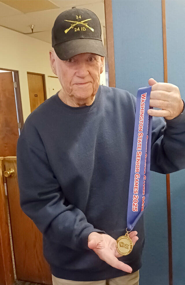 Gerald Rettela of Port Angeles joined a number of Olympic Peninsula track and field athletes in winning a blue ribbon at the Washington state senior games last month in Olympia. Rettela, 90 years old, came in first in the 85-plus doubles age bracket for racquetball. Two years ago, he also placed third in racquetball singles and second in doubles in the national senior games in Pittsburgh. (Pierre LaBossiere/Peninsula Daily News)